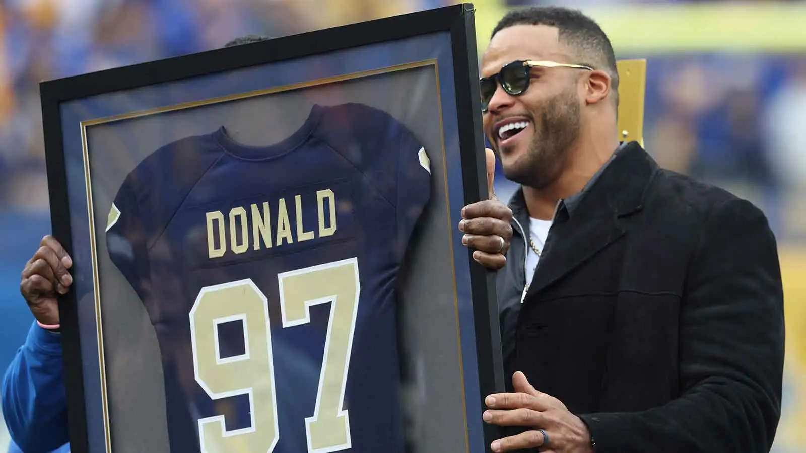 Pittsburgh Panthers former defensive end Aaron Donald (97) reacts during his jersey retirement ceremony during half-time of the game against the Notre Dame Figh…