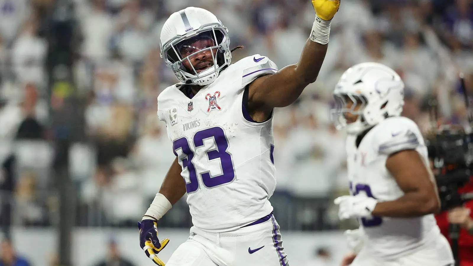 Dec 25, 2025; Minneapolis, Minnesota, USA; Minnesota Vikings running back Aaron Jones Sr. (33) celebrates after scoring a touchdown against the Detroit Lions in…