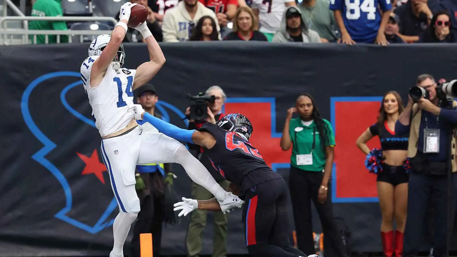Indianapolis Colts wide receiver Alec Pierce (14) is pushed out of bounds by Houston Texans cornerback Ja'marcus Ingram (42) during the second half at NRG Stadi…
