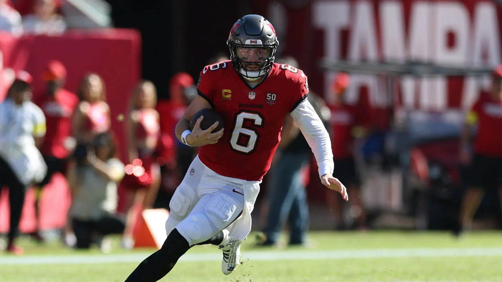 Nov 30, 2025; Tampa, Florida, USA; Tampa Bay Buccaneers quarterback Baker Mayfield (6) scrambles during the first half against the Arizona Cardinals at Raymond…