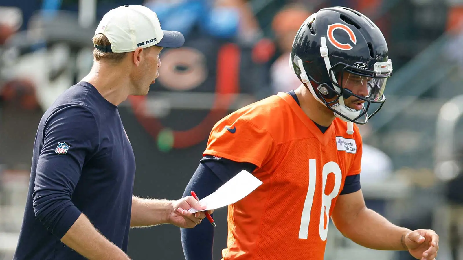 Jul 31, 2026; Lake Forest, IL, USA; Chicago Bears head coach Ben Johnson talks to quarterback Caleb Williams (18) during Training Camp at Halas Hall. Mandatory…