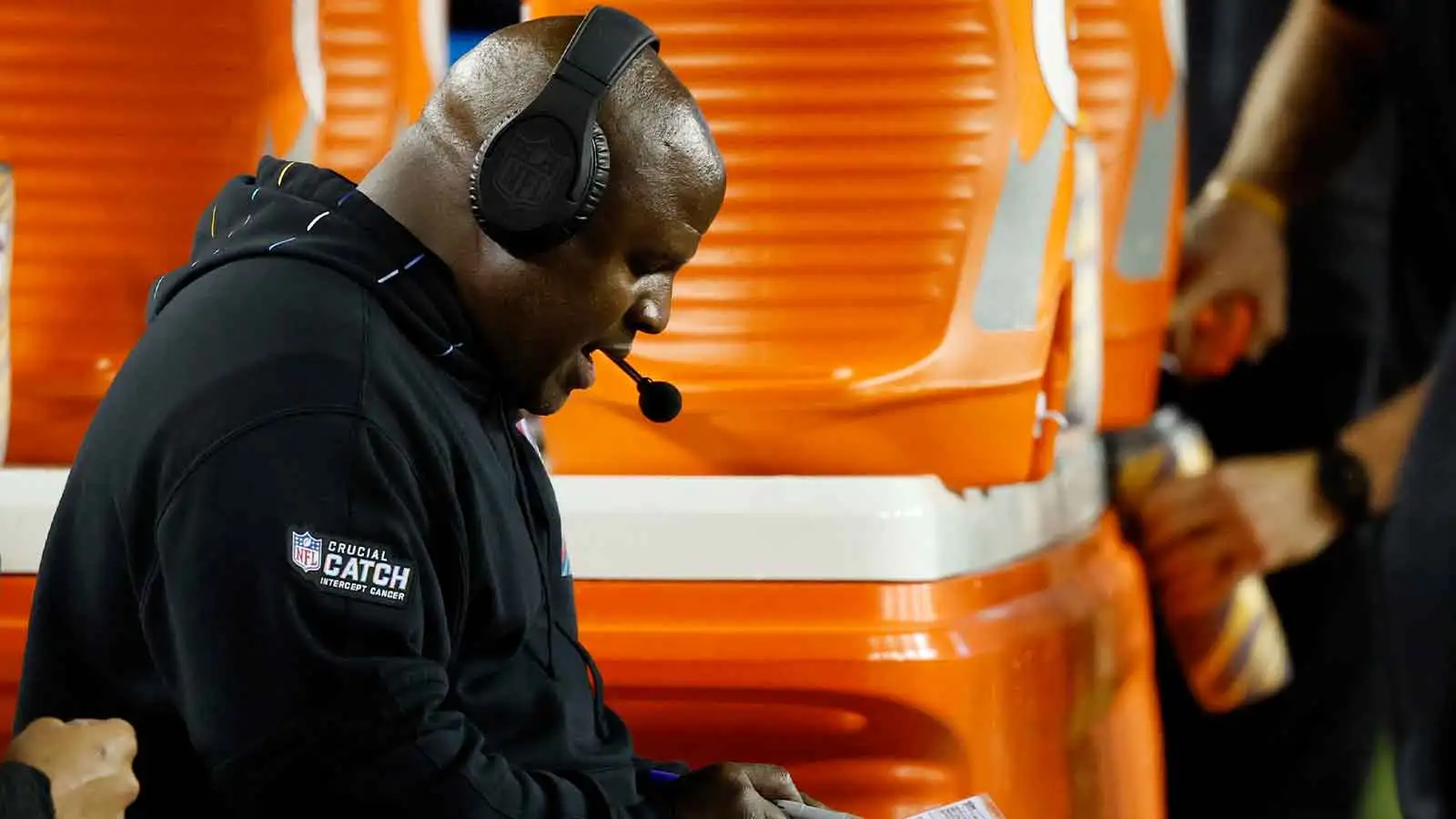 Oct 5, 2023; Landover, Maryland, USA; Washington Commanders assistant head coach/offensive coordinator Eric Bieniemy sits on the bench against the Chicago Bears…