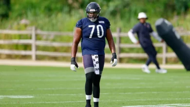 Jul 31, 2026; Lake Forest, IL, USA; Chicago Bears offensive tackle Braxton Jones (70) walks on the field during Training Camp at Halas Hall. Mandatory Credit: K…