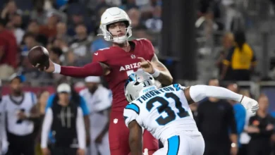 Aug 6, 2026; Canton, Ohio, USA; Arizona Cardinals quarterback Carson Beck (19) throws the ball against Carolina Panthers cornerback Corey Thornton (31) at Tom B…