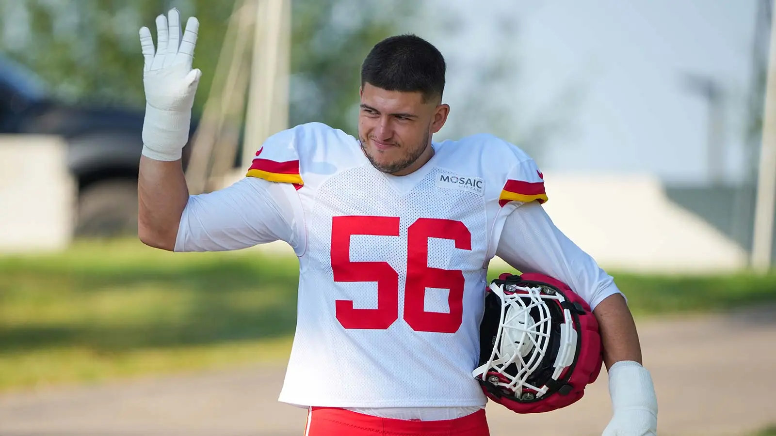 Aug 3, 2026; Kansas City, MO, USA; Kansas City Chiefs defensive end George Karlaftis (56) walks down the hill to the fields prior to training camp at Missouri W…