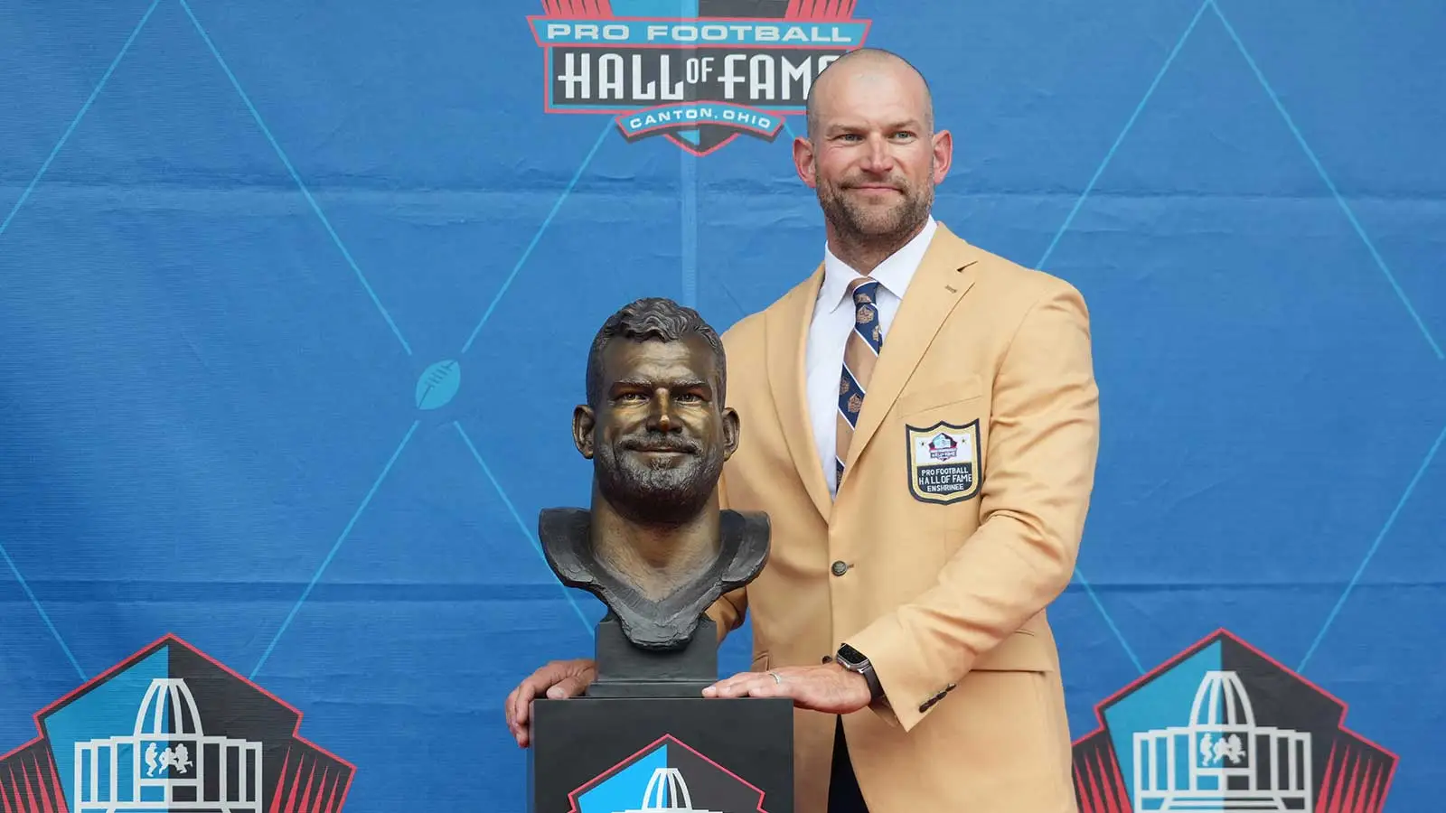 Aug 5, 2023; Canton, OH, USA; Cleveland Browns former offensive tackle Joe Thomas poses with his bust during the 2023 Pro Football Hall of Fame Enshrinement at…