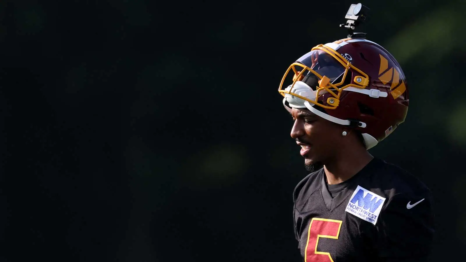 Jul 29, 2026; Ashburn, VA, USA; Washington Commanders quarterback Jayden Daniels (5) stands on the field during a drill on day one of training camp at BigBear.a…