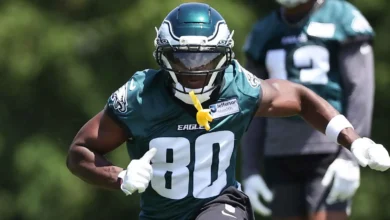 Philadelphia Eagles wide receiver Darius Cooper (80) makes a catch as Washington Commanders cornerback Jonathan Jones (31) defends during the second quarter at…