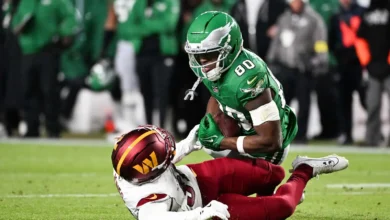 Jan 4, 2026; Philadelphia, Pennsylvania, USA; Philadelphia Eagles wide receiver Darius Cooper (80) makes a catch as Washington Commanders cornerback Jonathan Jo…