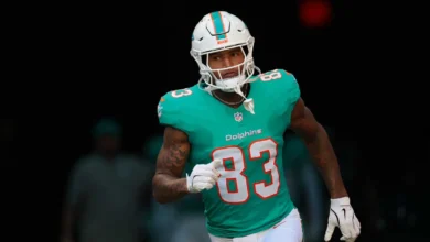 Dec 28, 2025; Miami Gardens, Florida, USA; Miami Dolphins tight end Darren Waller (83) runs out for player introductions prior to a game against the Tampa Bay B…