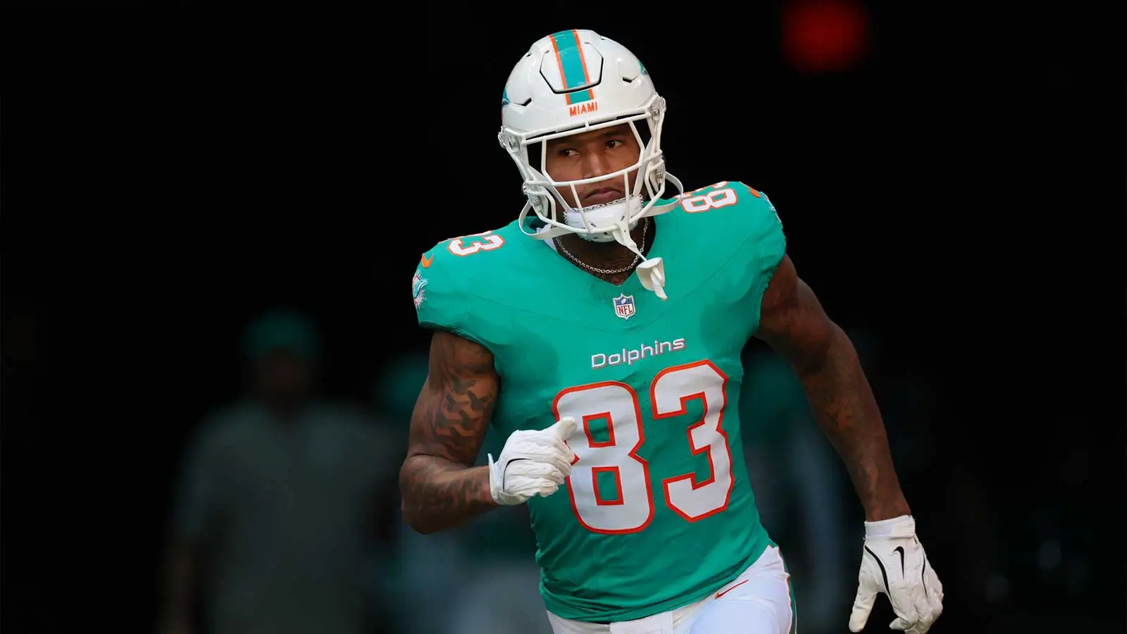 Dec 28, 2025; Miami Gardens, Florida, USA; Miami Dolphins tight end Darren Waller (83) runs out for player introductions prior to a game against the Tampa Bay B…