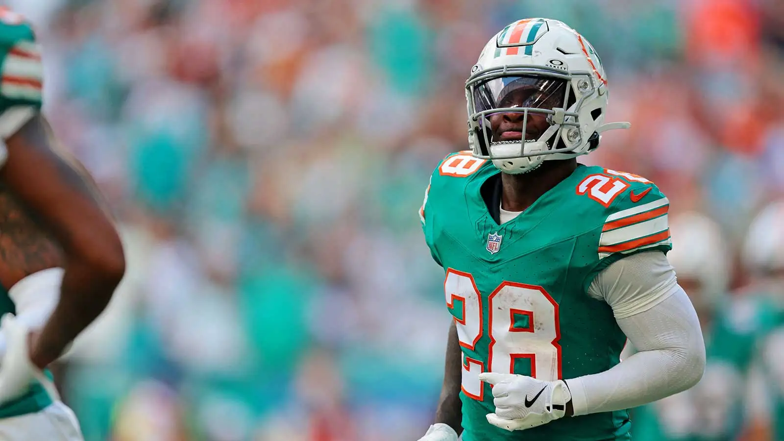 Dec 21, 2025; Miami Gardens, Florida, USA; Miami Dolphins running back De'Von Achane (28) reacts after scoring a touchdown during the first quarter against the…
