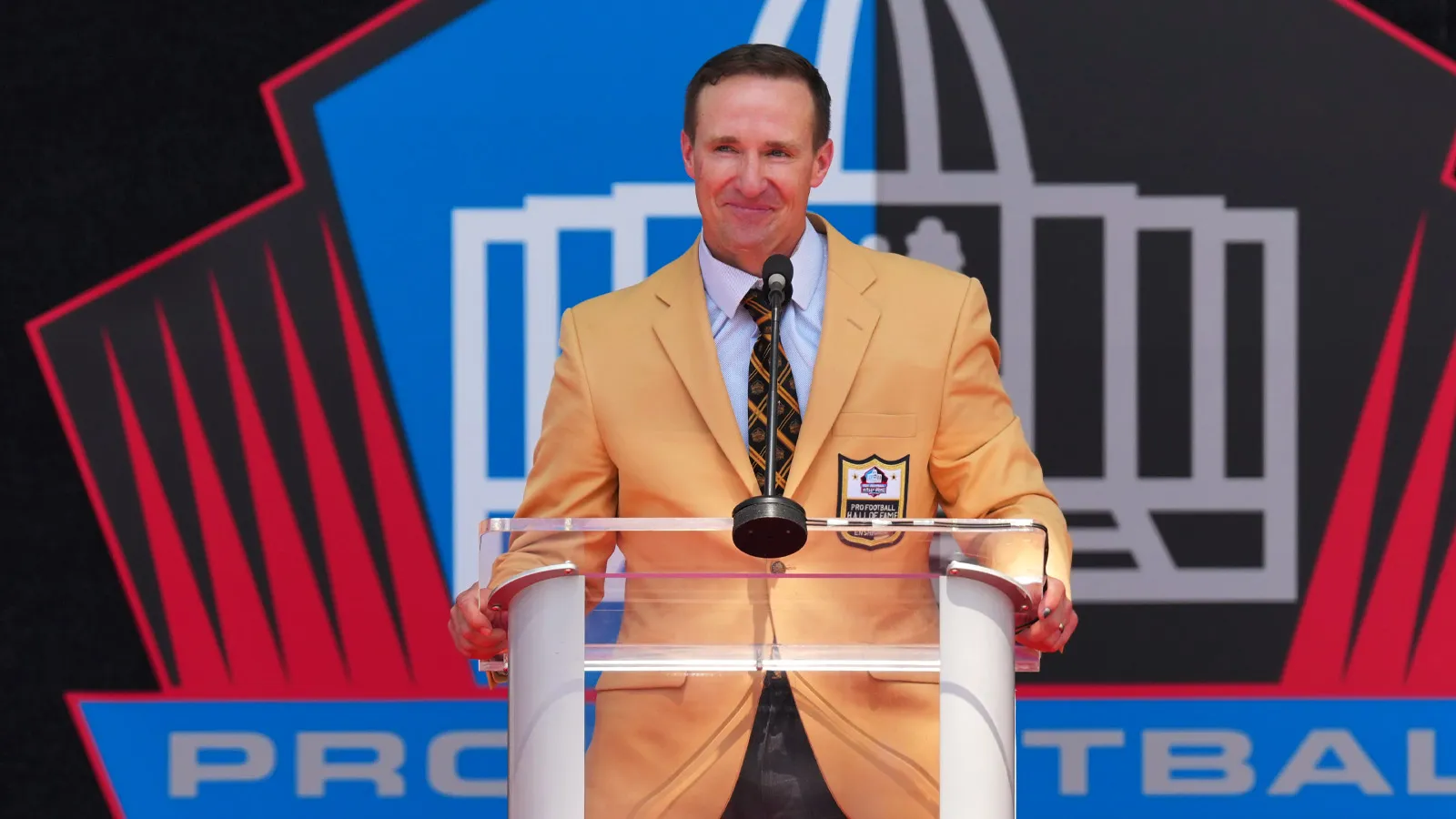 Aug 8, 2026; Canton, OH, USA; Pro Football Hall of Fame enshrinee Drew Brees speaks during the Class of 2026 enshrinement ceremony at Tom Benson Hall of Fame St…