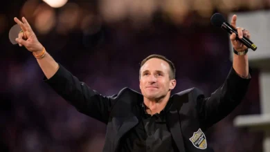 Oct 17, 2024; New Orleans, Louisiana, USA; New Orleans Saints retired quarterback Drew Brees (9) reacts during his hall of fame ceremony at halftime against the…