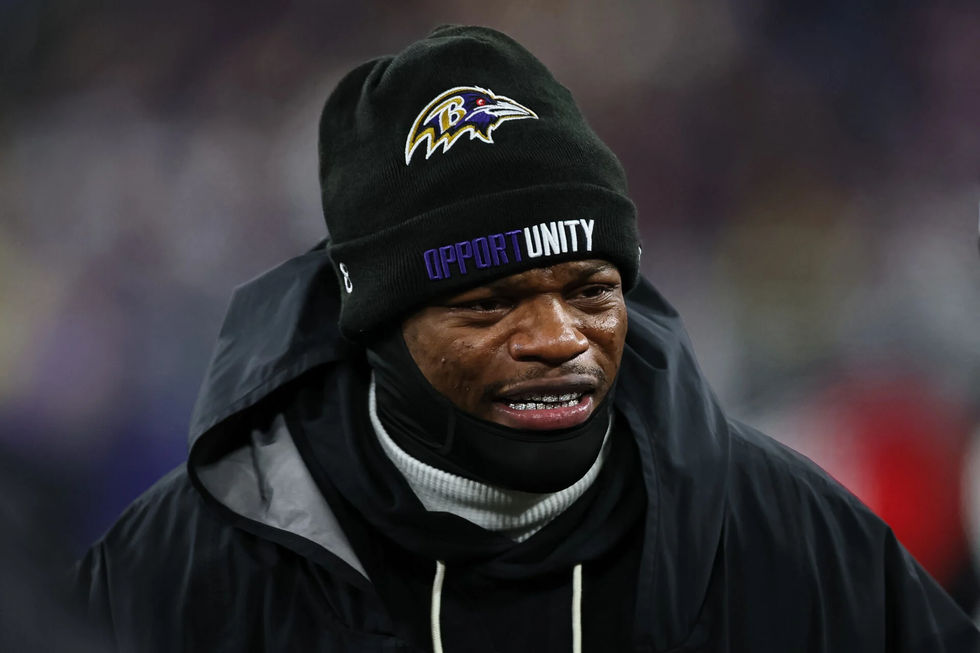 Lamar Jackson #8 of the Baltimore Ravens stands on the sideline during the national anthem prior to an NFL football game against the Pittsburgh Steelers at Acri…