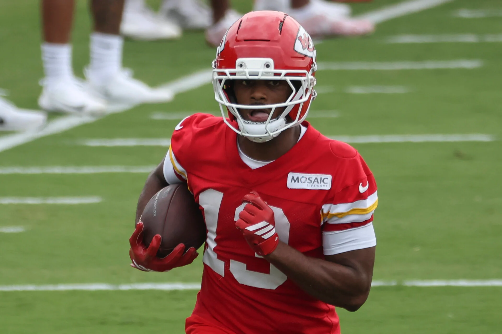 Cyrus Allen #13 walks to the field during the Kansas City Chiefs training camp