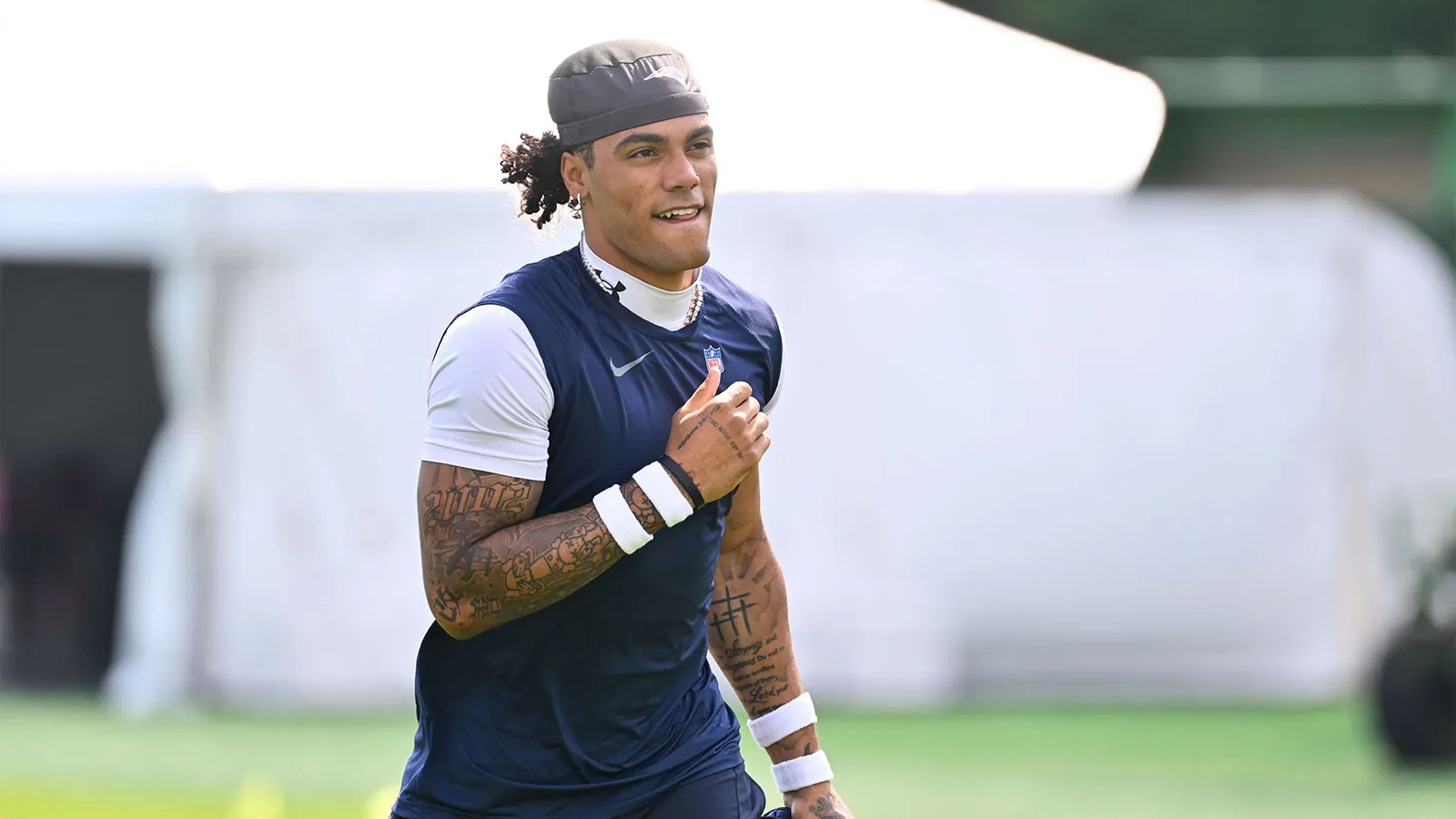 Jul 28, 2026; Foxborough, MA, USA; New England Patriots cornerback Christian Gonzalez (0) walks to practice for training camp at Gillette Stadium. Mandatory Cre…