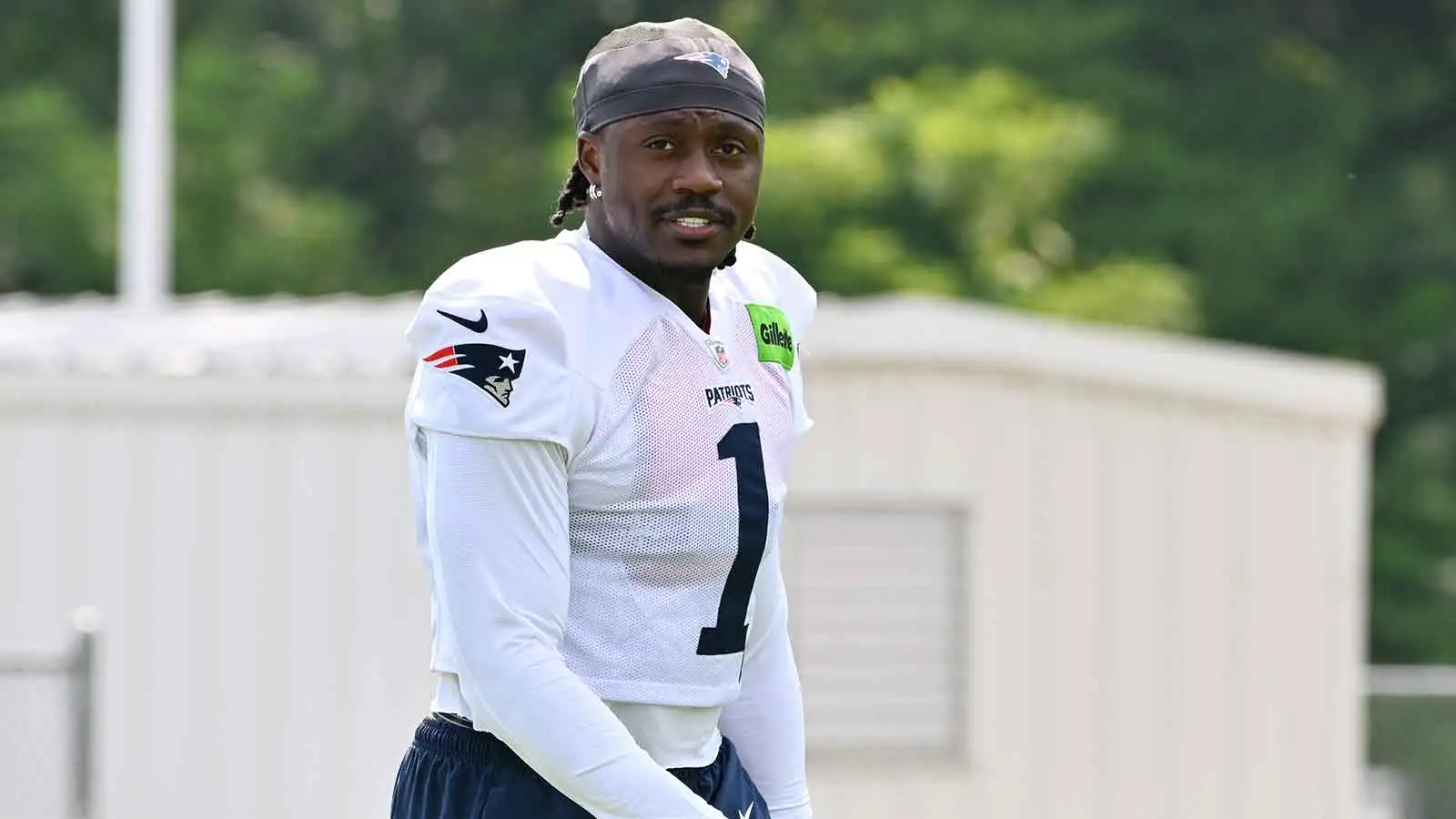 Jul 28, 2026; Foxborough, MA, USA; New England Patriots wide receiver A.J. Brown (1) walks to practice for training camp at Gillette Stadium. Mandatory Credit:…