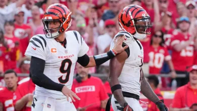 Sep 15, 2024; Kansas City, Missouri, USA; Cincinnati Bengals quarterback Joe Burrow (9) restrains wide receiver Ja'Marr Chase (1) after an altercation with offi…