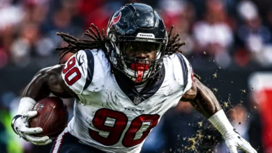 Jadeveon Clowney in Houston Texans uniform pursuing quarterback