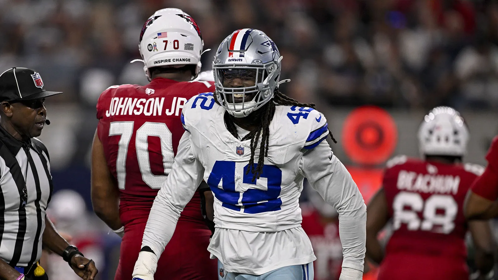 Dallas Cowboys defensive end Jadeveon Clowney (42) celebrates after he sacks Arizona Cardinals quarterback Jacoby Brissett (7) during the game between the Dalla…
