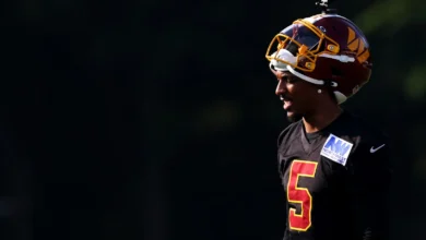 Jul 29, 2026; Ashburn, VA, USA; Washington Commanders quarterback Jayden Daniels (5) stands on the field during a drill on day one of training camp at BigBear.a…