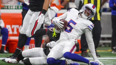 Oct 13, 2025; Atlanta, Georgia, USA; Buffalo Bills wide receiver Josh Palmer (5) is tackled by. Atlanta Falcons cornerback Dee Alford (20) during the first half…