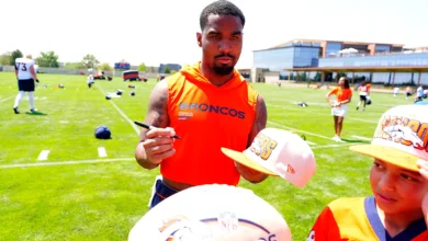 Jul 31, 2026; Englewood, CO, USA; Denver Broncos wide receiver Jaylen Waddle (17) signs autographs following training camp at Broncos Park. Mandatory Credit: Ro…