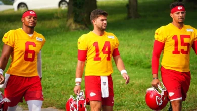 Jul 29, 2026; St. Joseph, MO, USA; Kansas City Chiefs quarterbacks Justin Fields (6) and Garrett Nussmeier and Patrick Mahomes (15) walk down the hill to the fi…