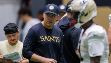 Aug 02, 2026; Metairie, LA, USA; New Orleans Saints head coach Kellen Moore looks on during training camp at Ochsner Sports Performance Center. Mandatory Credit…