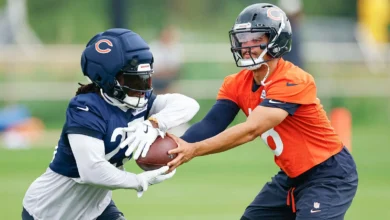 Aug 5, 2026; Lake Forest, IL, USA; Chicago Bears quarterback Caleb Williams (18) passes the ball to running back Kyle Monangai (25) during training camp at Hala…