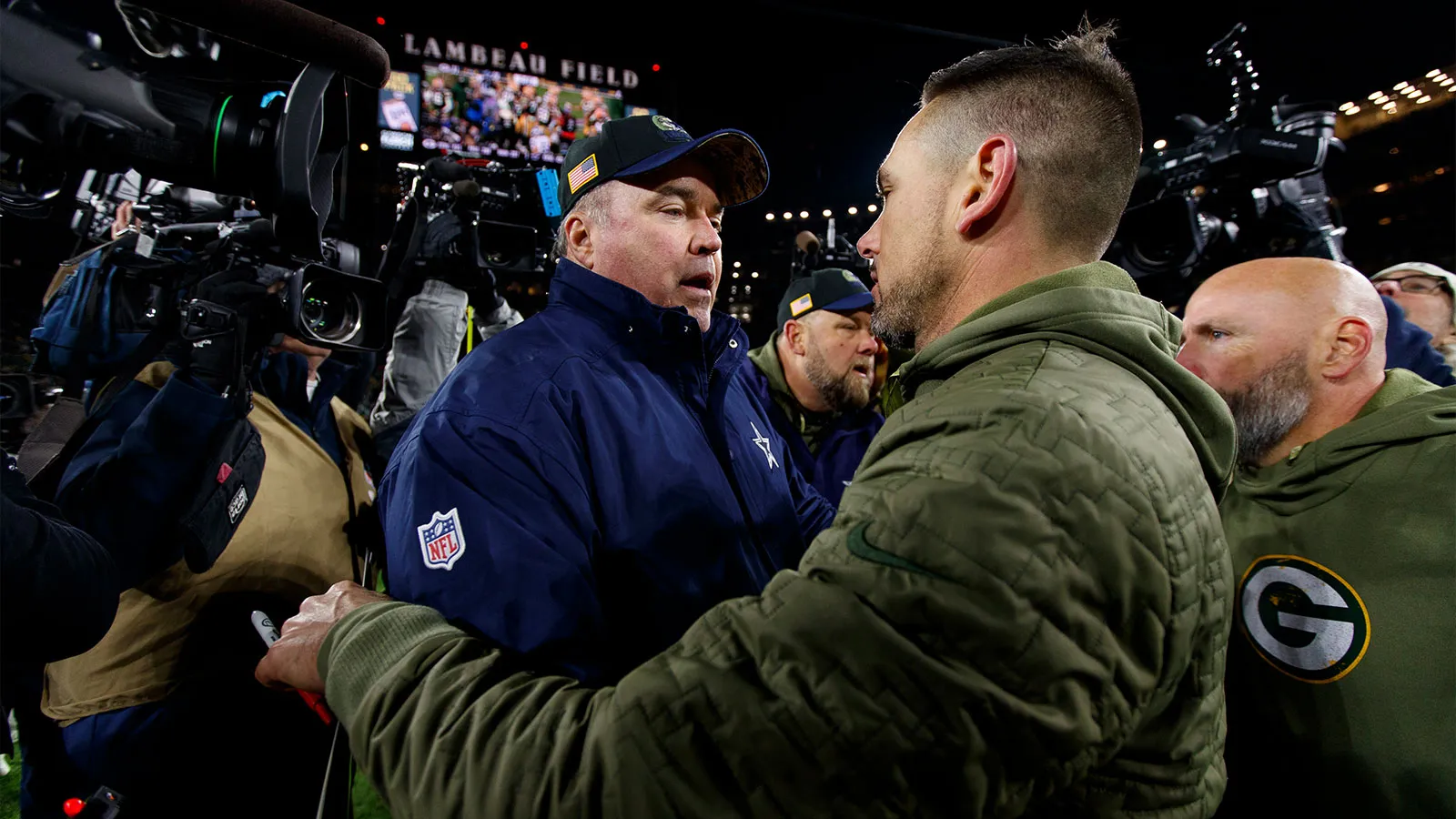 Nov 13, 2022; Green Bay, Wisconsin, USA; Dallas Cowboys head coach Mike McCarthy talks with Green Bay Packers head coach Matt LaFleur following the game at Lamb…