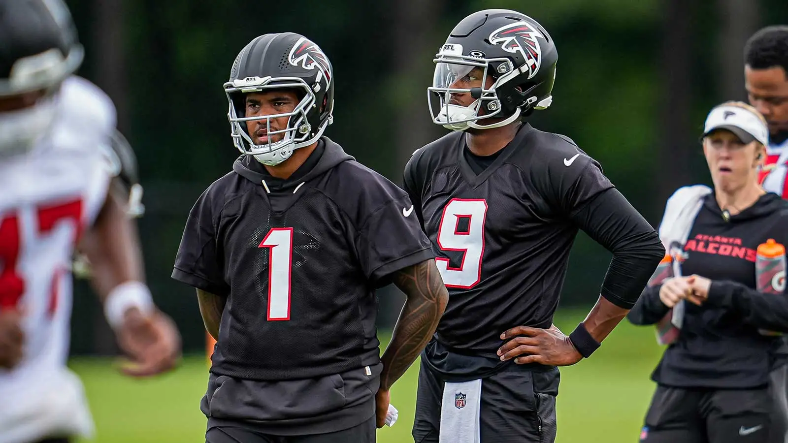 Jun 16, 2026; Atlanta, GA, USA; Atlanta Falcons quarterbacks Tua Tagovailoa (1) and Michael Penix Jr. (9) on the field during Minicamp. Mandatory Credit: Dale Z…