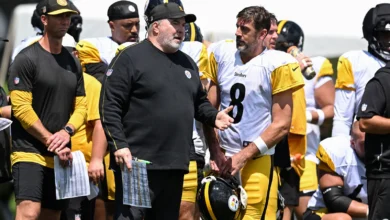 Aug 03, 2026; Latrobe, PA, USA; Pittsburgh Steelers head coach Mike McCarthy talks with quarterback Aaron Rodgers (8) during a practice session at Training camp…