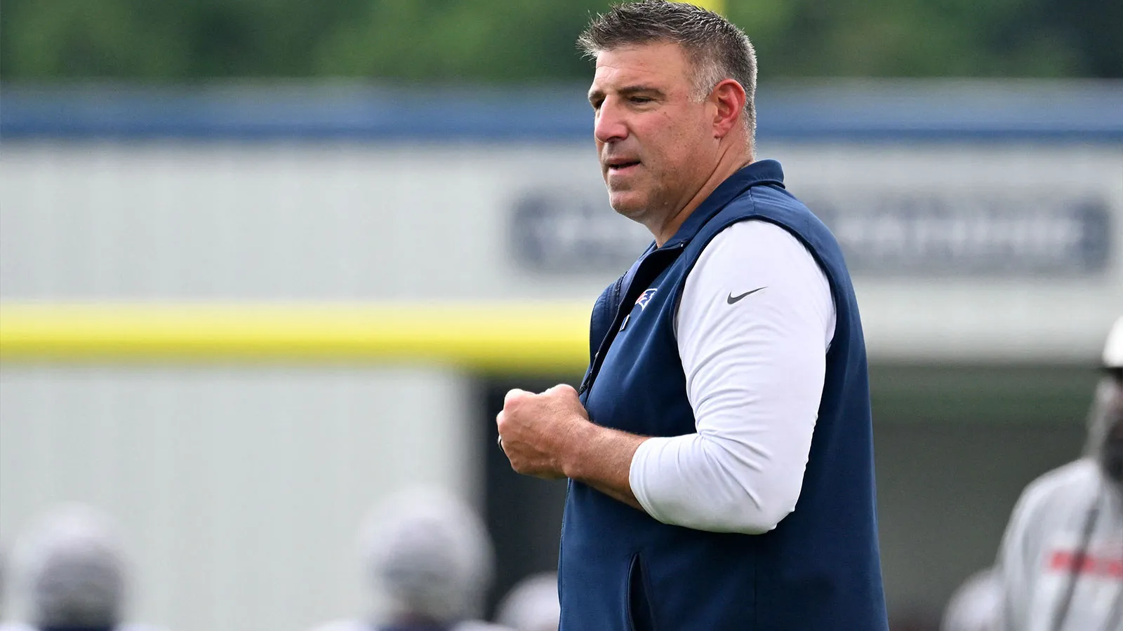 Jul 28, 2026; Foxborough, MA, USA; New England Patriots head coach Mike Vrabel watches over practice during training camp at Gillette Stadium. Mandatory Credit:…