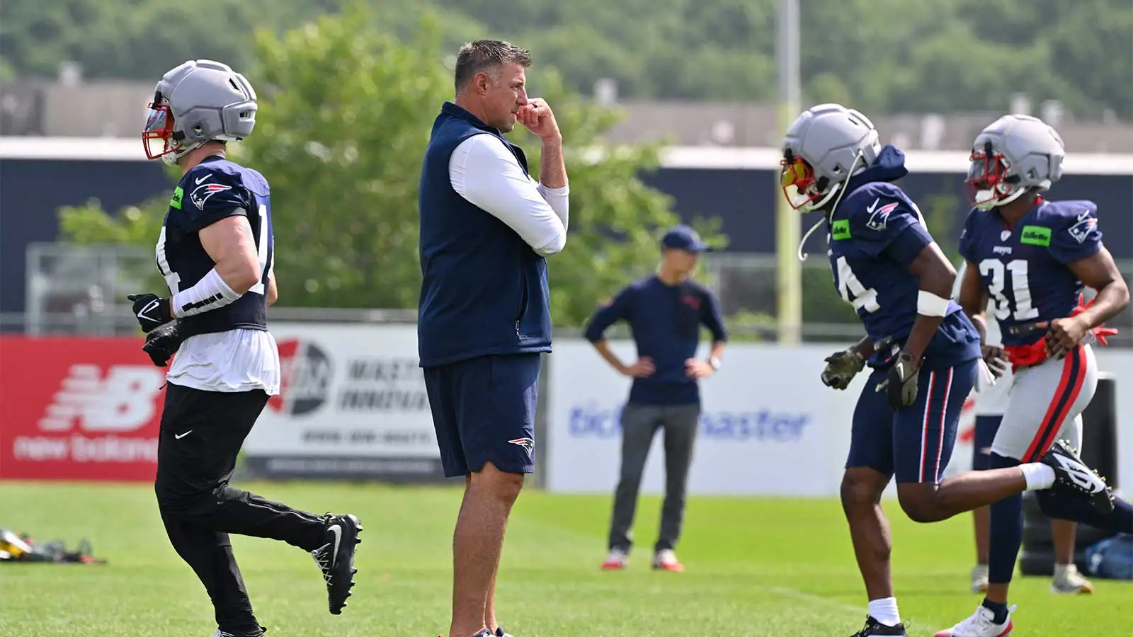 New England Patriots head coach Mike Vrabel watches over practice during training camp at Gillette Stadium.