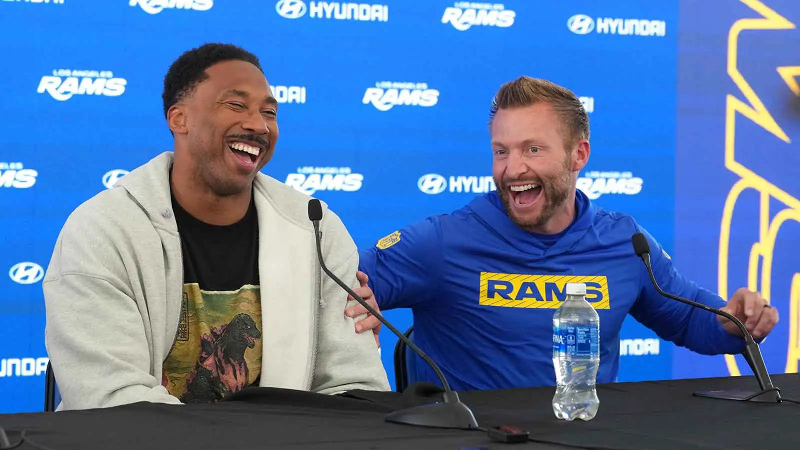 Los Angeles Rams defensive end Myles Garrett (left) and coach Sean McVay react at press conference at Rams Practice Facility.