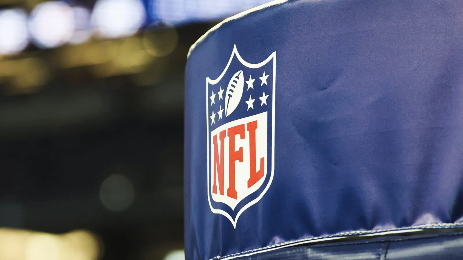 Dec 21, 2025; Arlington, Texas, USA; Detail of NFL logo on a goal post pad before a game between the Los Angeles Chargers and Dallas Cowboys at AT&T Stadium. Ma…