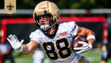 New Orleans Saints rookie tight end Oscar Delp catching a football in practice gear during training camp
