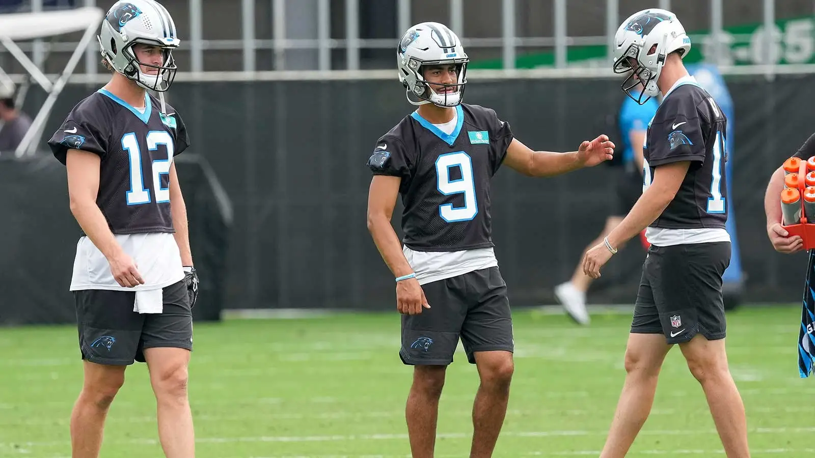 Aug 4, 2026; Charlotte, NC, USA; Quarterbacks Kenny Pickett (12), quarterback Bryce Young (9) and Haynes King (16) during training camp at Bank of America Stadi…