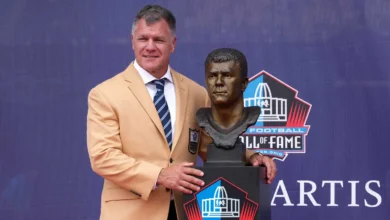 Aug 8, 2026; Canton, OH, USA; Pro Football Hall of Fame enshrinee Adam Vinatieri poses with his bust during the Class of 2026 enshrinement ceremony at Tom Benso…