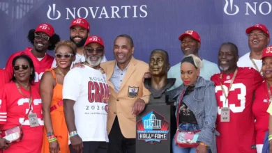 Aug 8, 2026; Canton, OH, USA; Pro Football Hall of Fame enshrinee Roger Craig poses with his bust and family during the Class of 2026 enshrinement ceremony at T…