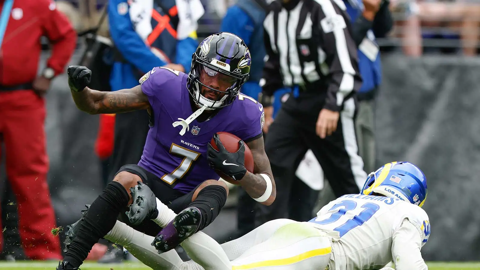 Oct 12, 2025; Baltimore, Maryland, USA; Los Angeles Rams cornerback Darious Williams (31) tackles Baltimore Ravens wide receiver Rashod Bateman (7) during the f…