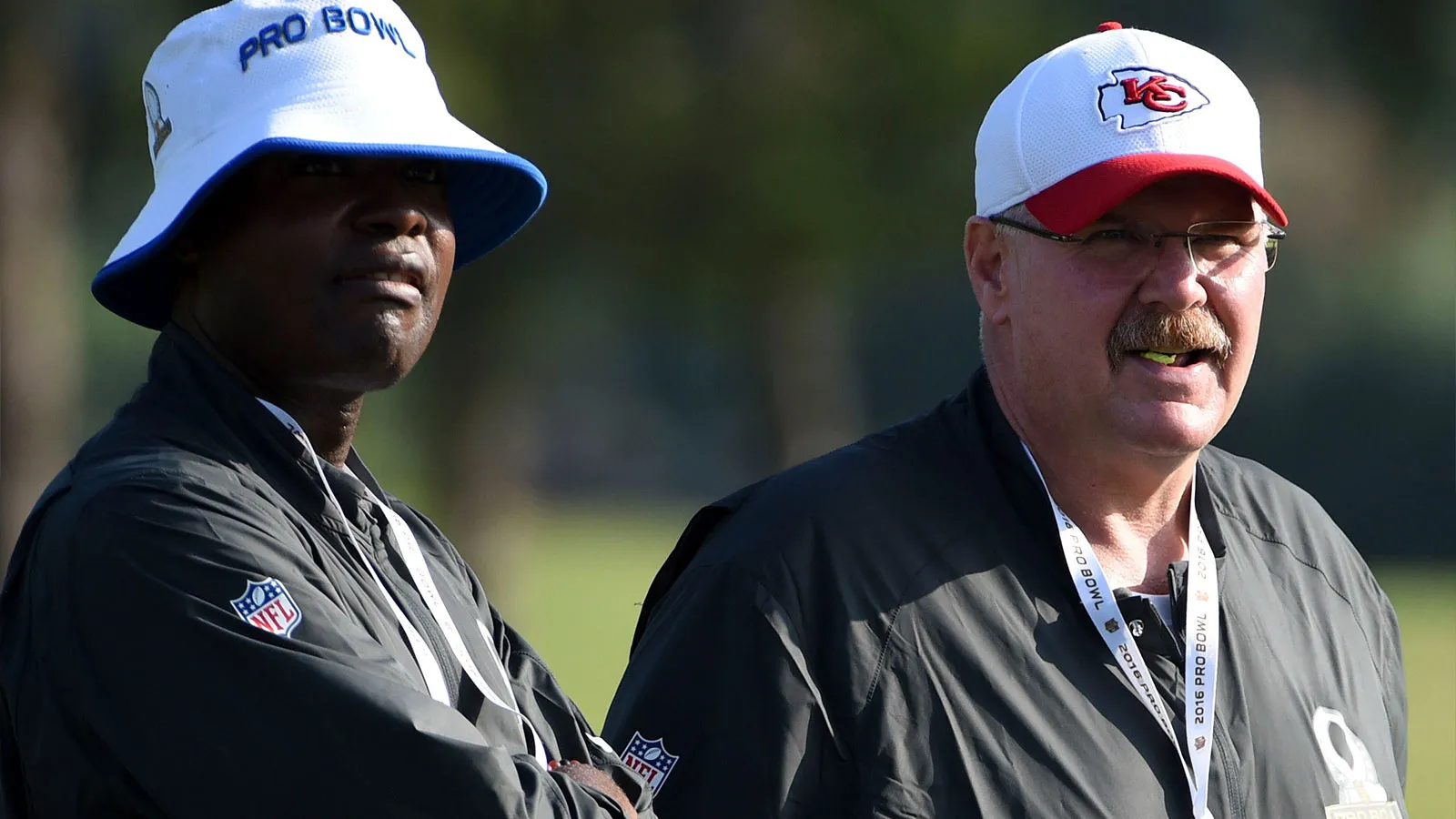Jan 28, 2016; Kahuku, HI, USA; Kansas City Chiefs running backs coach Eric Bieniemy (left) and coach Andy Reid during Team Rice practice for the 2016 Pro Bowl a…
