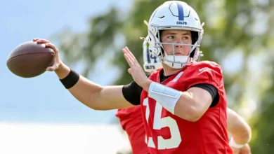Indianapolis Colts quarterback Riley Leonard (15) throws a pass during a drill on day one of training camp at Grand Park Sports Campus. Mandatory Credit: Robert…