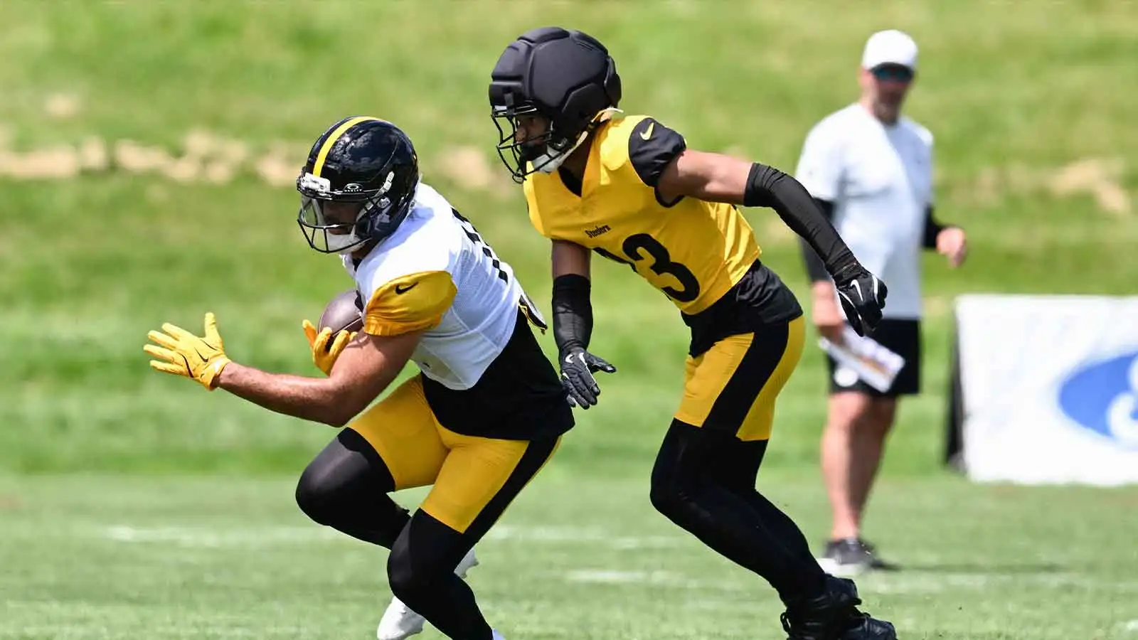 Pittsburgh Steelers wide receiver Michael Pittman Jr (11) looks to avoid cornerback Daylen Everette (23) during a practice session at Training camp at Saint Vin…