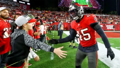 Jan 12, 2025; Tampa, Florida, USA; Tampa Bay Buccaneers linebacker Deion Jones (45) greets a fan before a NFC wild card playoff against the Washington Commander…