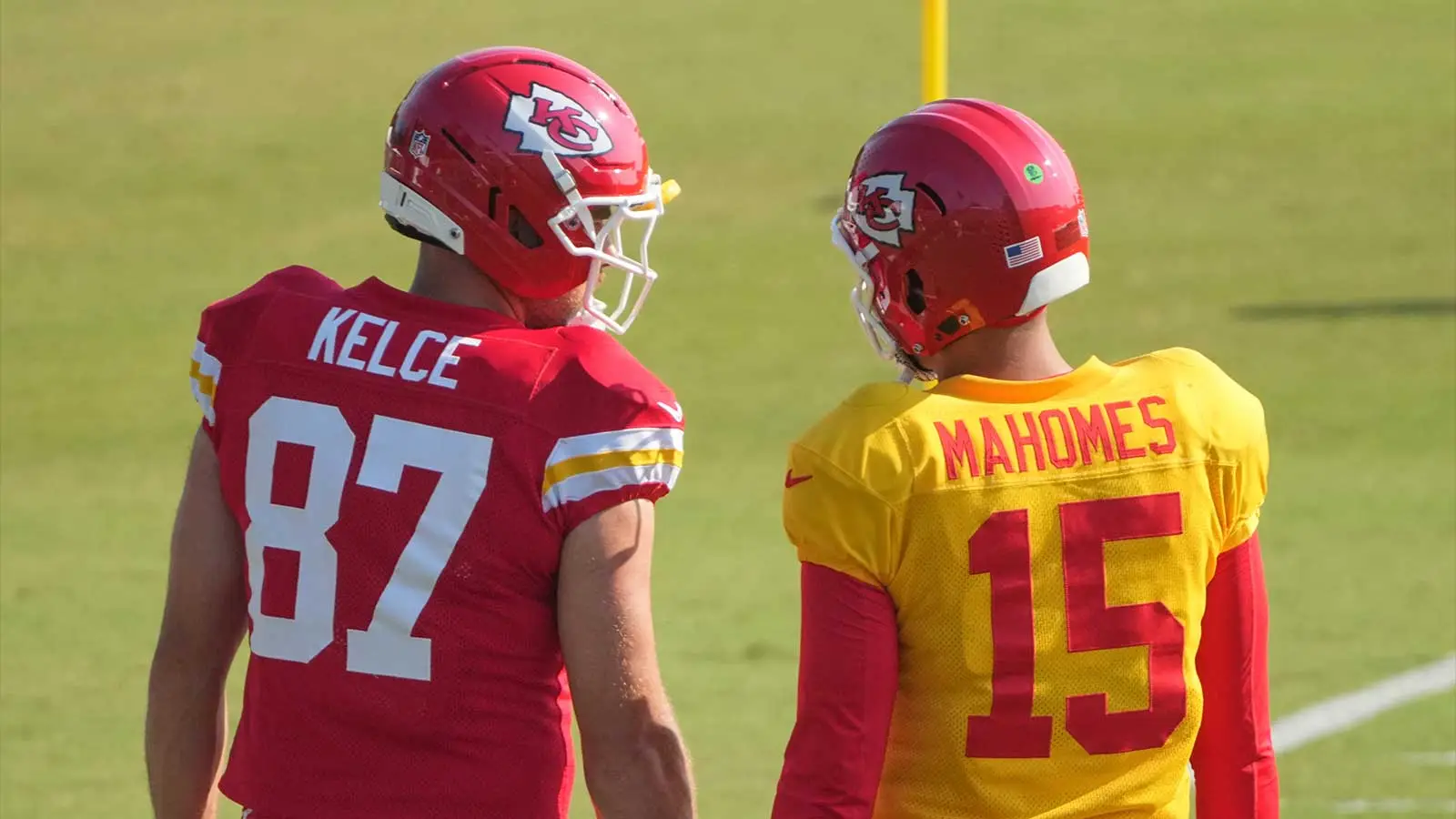Kansas City Chiefs quarterback Patrick Mahomes (15) laughs with tight end Travis Kelce (87) on the sidelines against the Chicago Bears during the game at GEHA F…