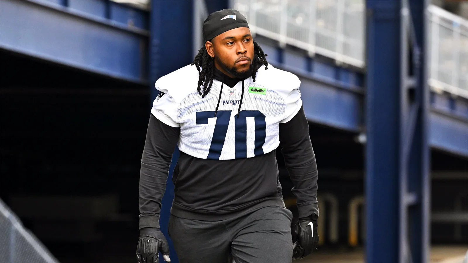 Jul 31, 2026; Foxborough, MA, USA; New England Patriots offensive tackle Caedan Wallace (70) walks to the practice field for training camp at Gillette Stadium.…