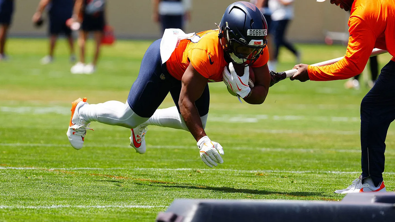 Jun 16, 2026; Englewood, CO, USA; Denver Broncos 2025-2026 running back J.K. Dobbins (27) during mini camp at Broncos Park. Mandatory Credit: Ron Chenoy-Imagn I…